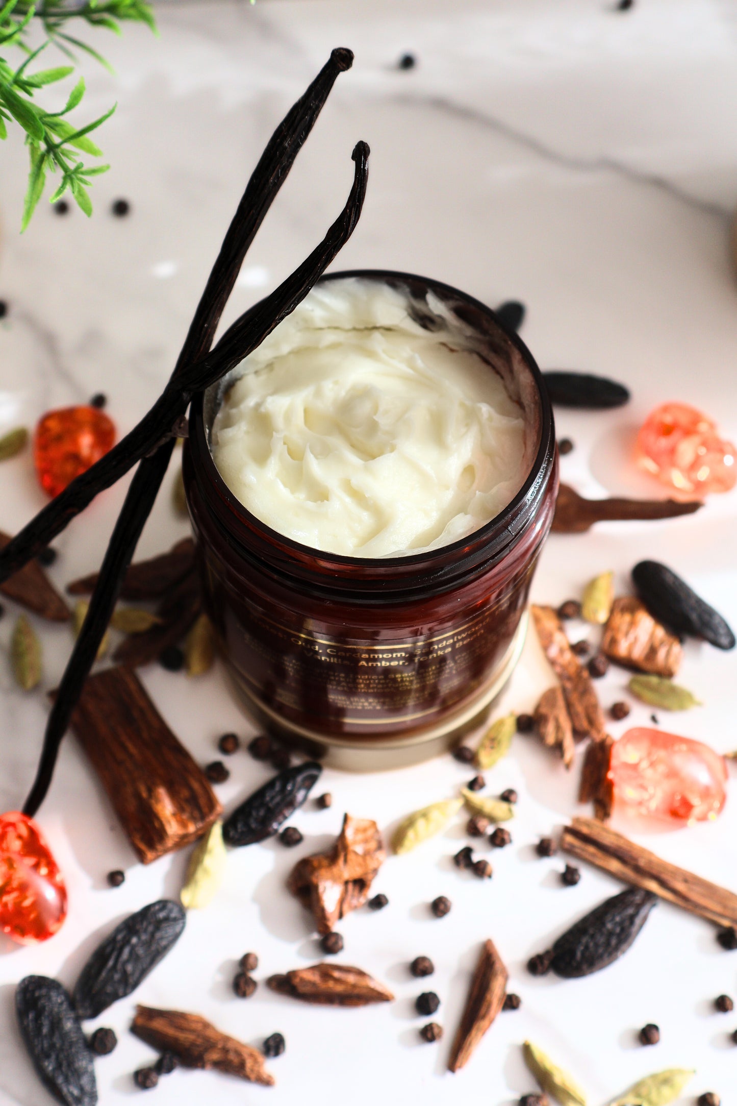 Luxury Woody Oud perfume body butter overhead view showing rich smooth texture and vanilla bean and woody accents
