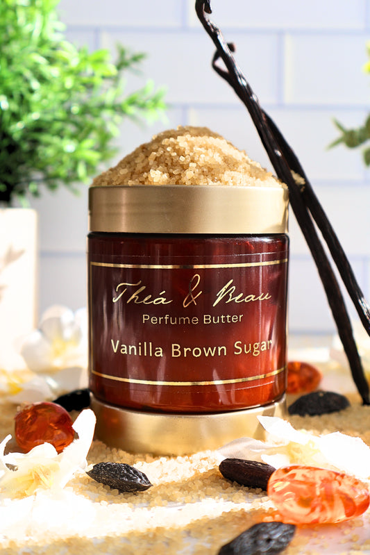 Vanilla Brown Sugar perfume body butter in our luxury jar on white surface with vanilla beans brown sugar and tonka beans